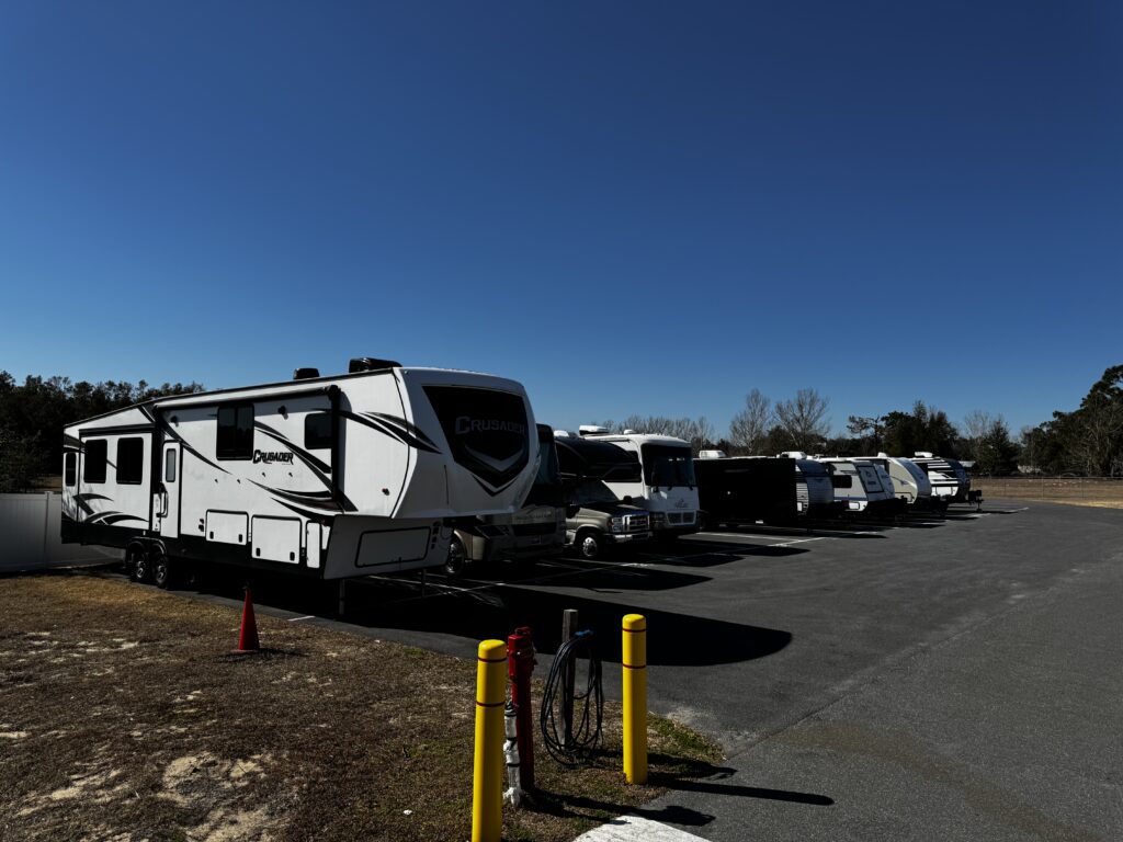 RV parked in outdoor vehicle storage area at Florida Secure Storage of Ocala